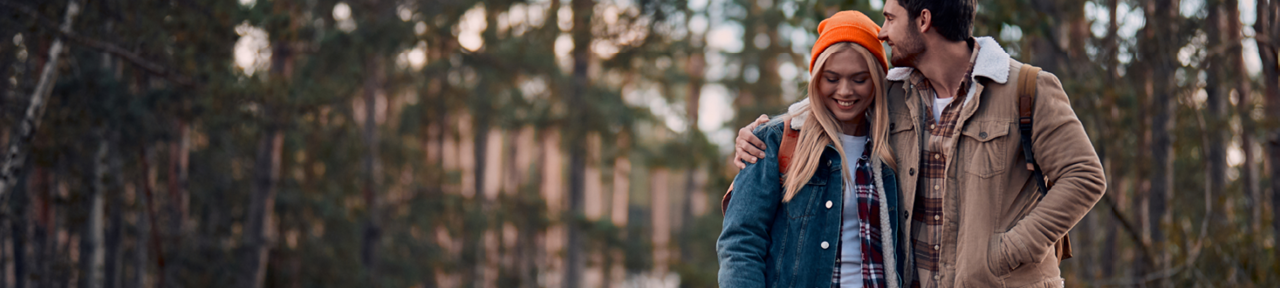 Couple Walking Closely Together in the Woods