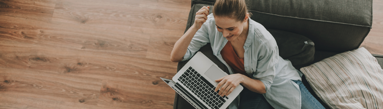 Woman Smiling Setting Up CRA Direct Deposit using Online Banking