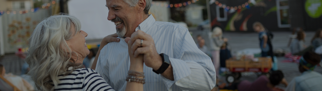 Couple Dancing in Celebration of Retirement at Party