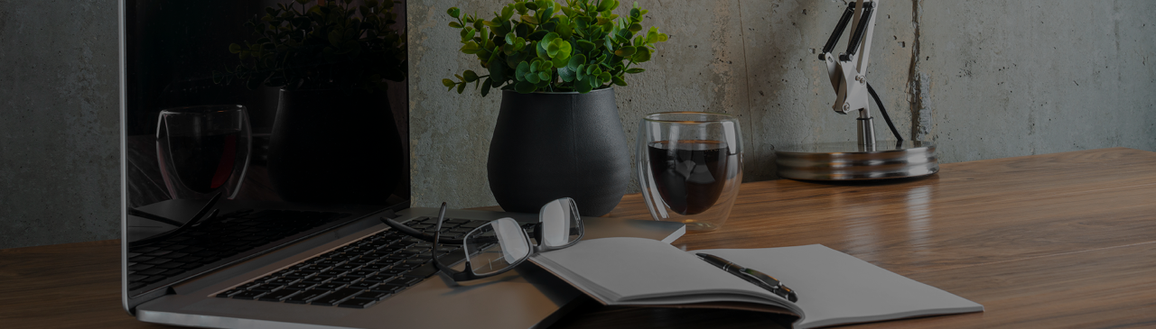 Desk with Laptop, Glasses, Notebook, Coffee, and Potted Plant