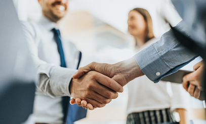 Investment Manager Shaking Hands with Member