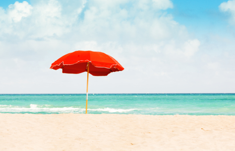 Umbrella on Beach by Water