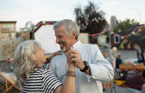 Couple Dancing in Celebration of Retirement at Party