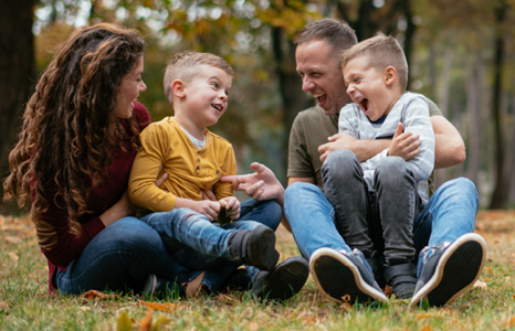 Family Laughing Together Outside in Autumn
