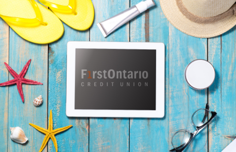 FirstOntario Mobile App on Tablet with Beach Essentials on Picnic Table