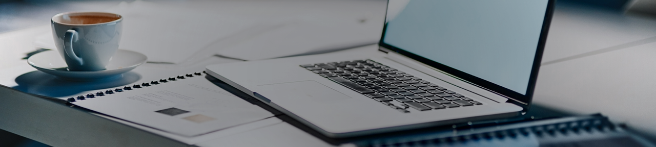 Open Laptop on Desk with Cappuccino