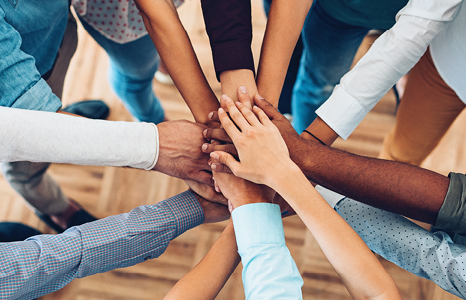 Group of People Putting Their Hands Together