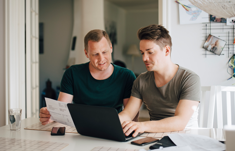 Couple Looking at Expenses on Computer