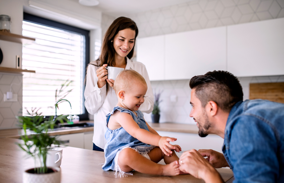 Parents and Baby Playing in Kitchen