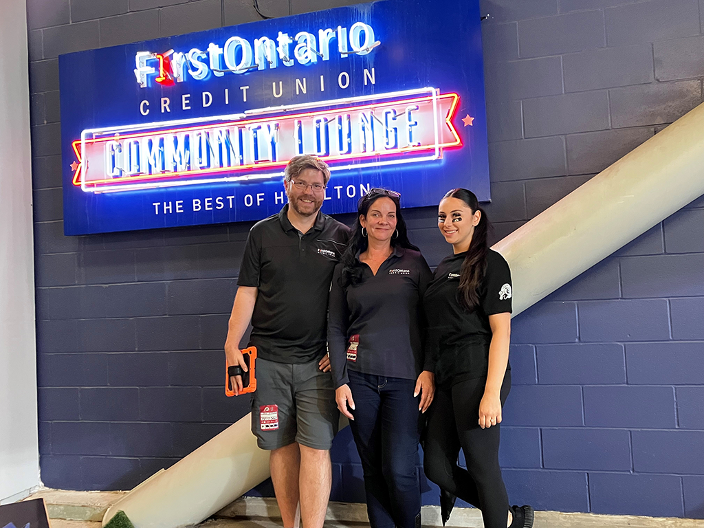 Three FirstOntario Blue Wave volunteers in the Community Lounge