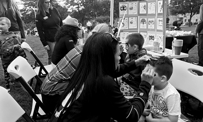 Children Getting Their Faces Painted at Event