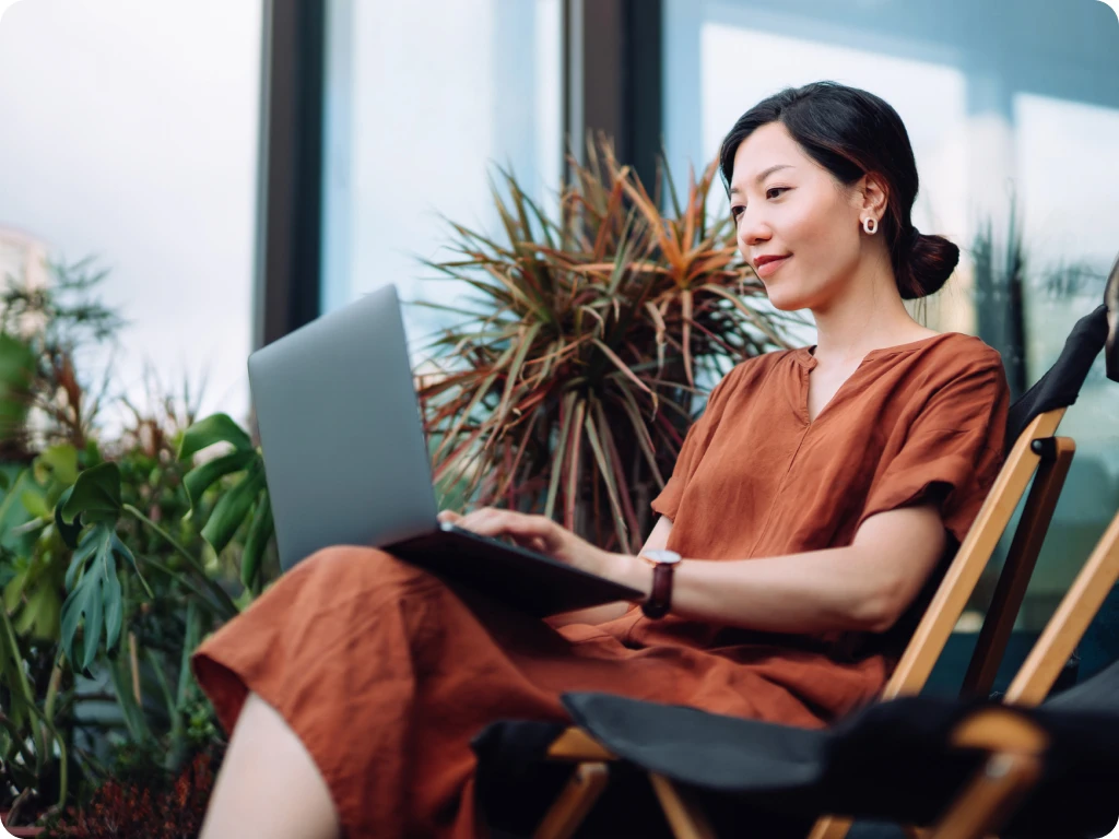 Woman Using Reserve Fund Investment Planning Tool on Laptop