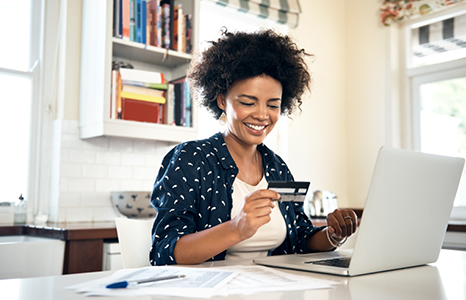 Person Entering Card Details to Log In Online