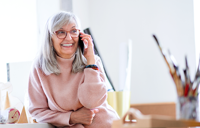 Woman Speaking to Support on Mobile Phone