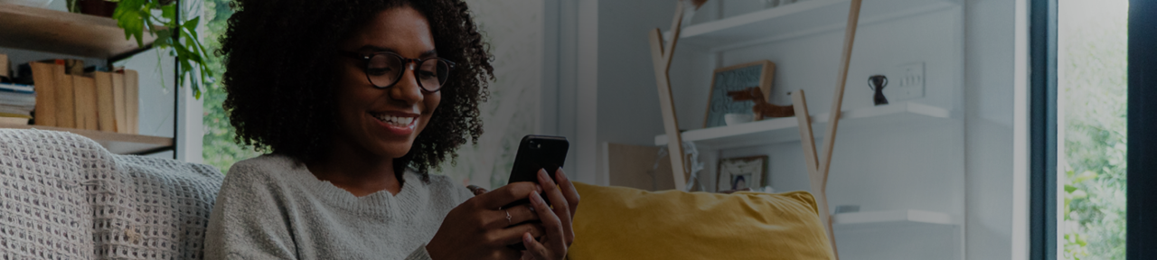 Broker viewing FirstOntario Dealer High Interest Savings Account rates on mobile phone