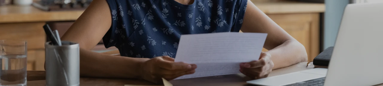 Person sitting at desk reading chip deactivation letter