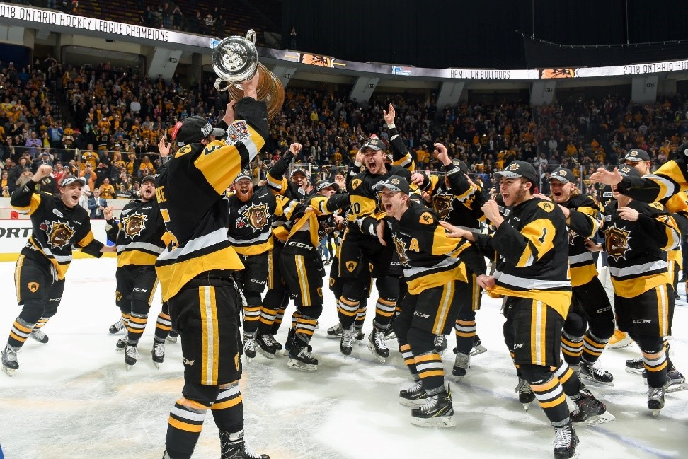 Hamilton Bulldogs Celebrating Winning Trophy on Ice