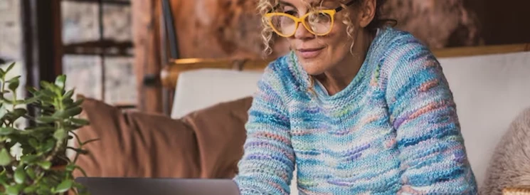 Woman preparing income taxes on laptop