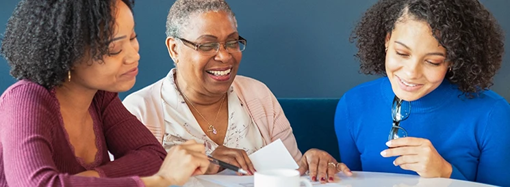 Family smiling while reviewing power of attorney documents