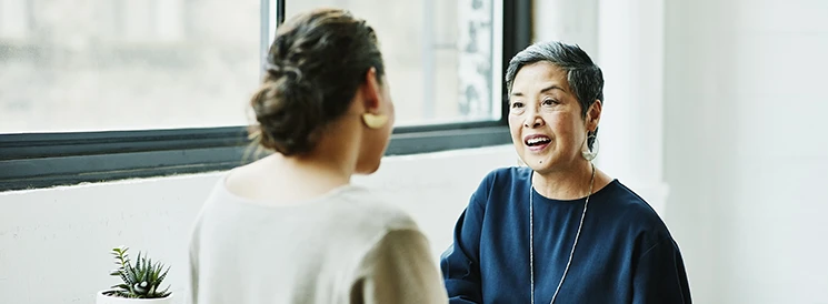 Two women discussing retirement