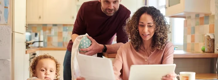 Couple looking at retirement savings paperwork in the ktichen