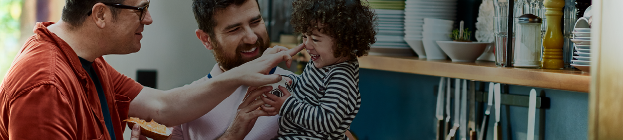 Family Laughing Together in the Kitchen