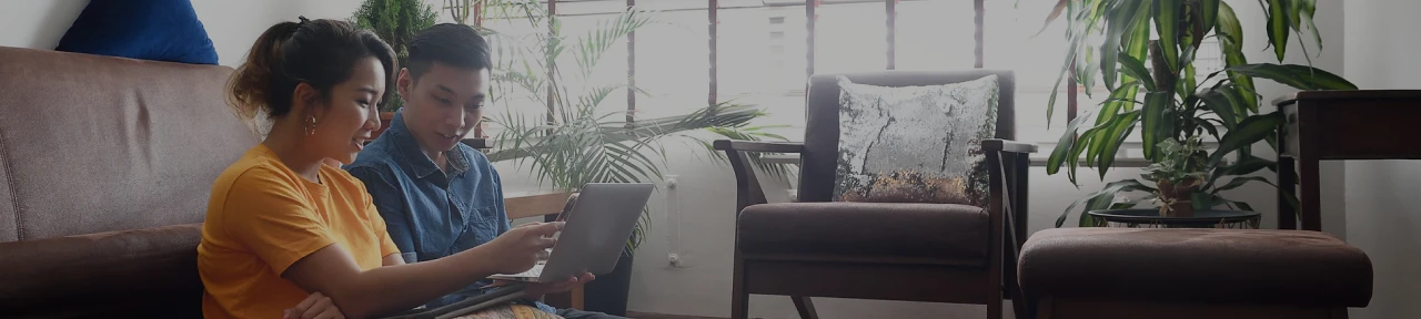 Couple Sitting Together and Planning to Buy a Home