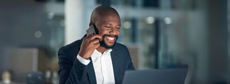 Man talking on cell phone in office