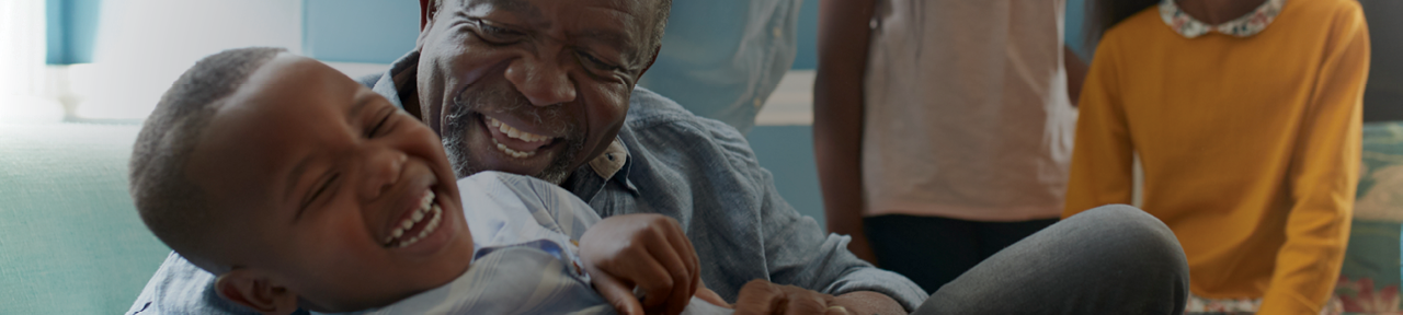 Grandparent and Grandchild Embracing and Smiling