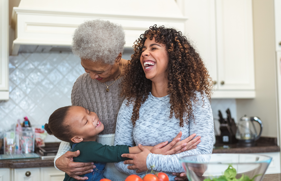 Family Embracing and Laughing in Kitched