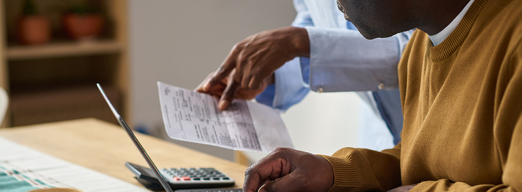 Two people reviewing income statements