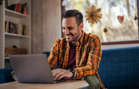 Man browsing new FirstOntario website on laptop