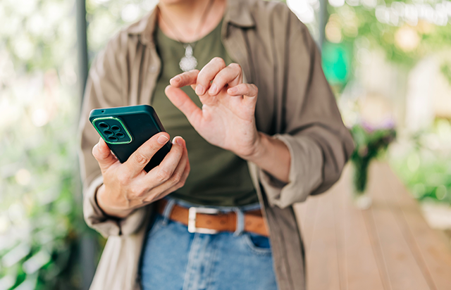 Woman using FirstOntario mobile app on smart phone