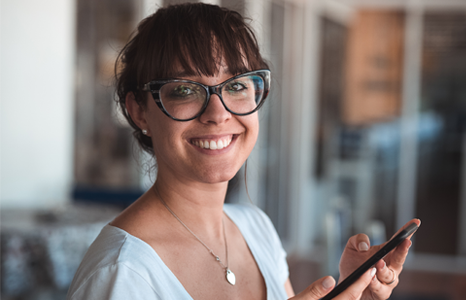 Woman Smiling While Using FirstOntario Mobile App