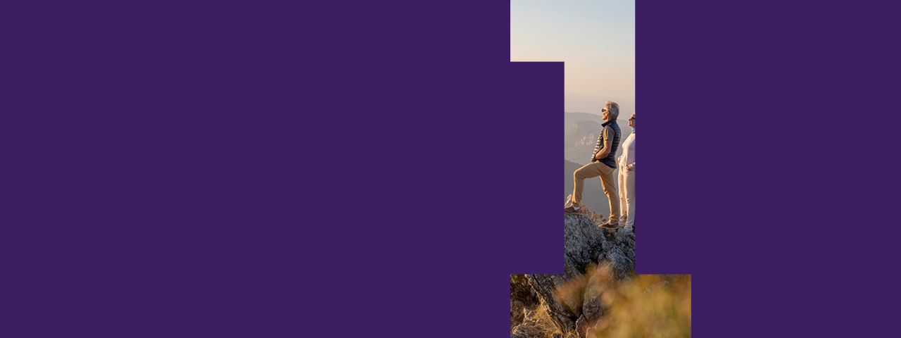 People Hiking Overlooking Mountains