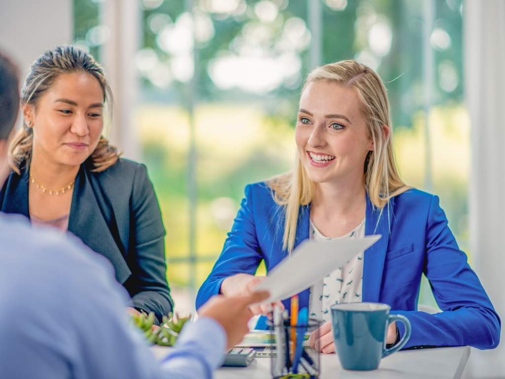 Couple discussing short term mortgages and renewals with representative