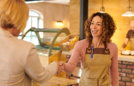 Small Business Owner Interacting with Customer