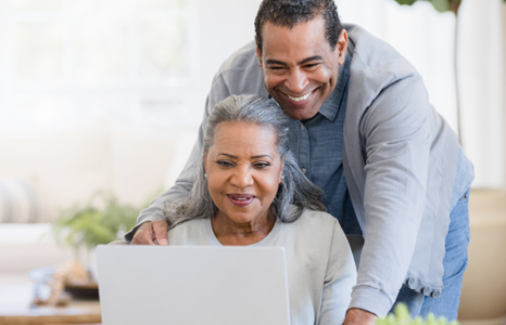 Couple smiling while applying for a premium FirstOntario Collabria credit card
