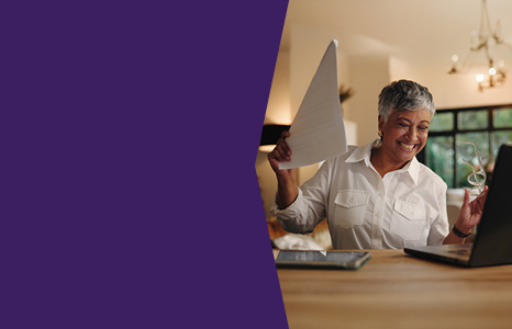 Woman celebrating receiving cashback from transferring account to FirstOntario Investments