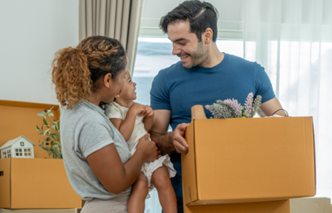Couple with young child moving into new home