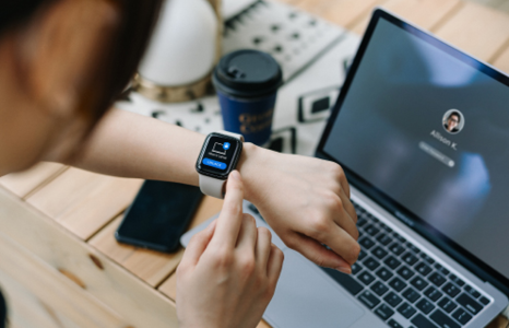 Person checking iWatch for login code
