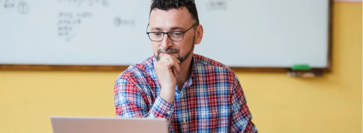 Man taking online course on laptop