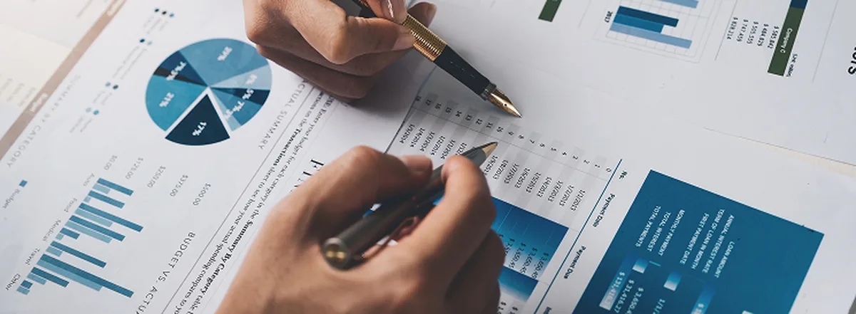 Two people assessing financial report 