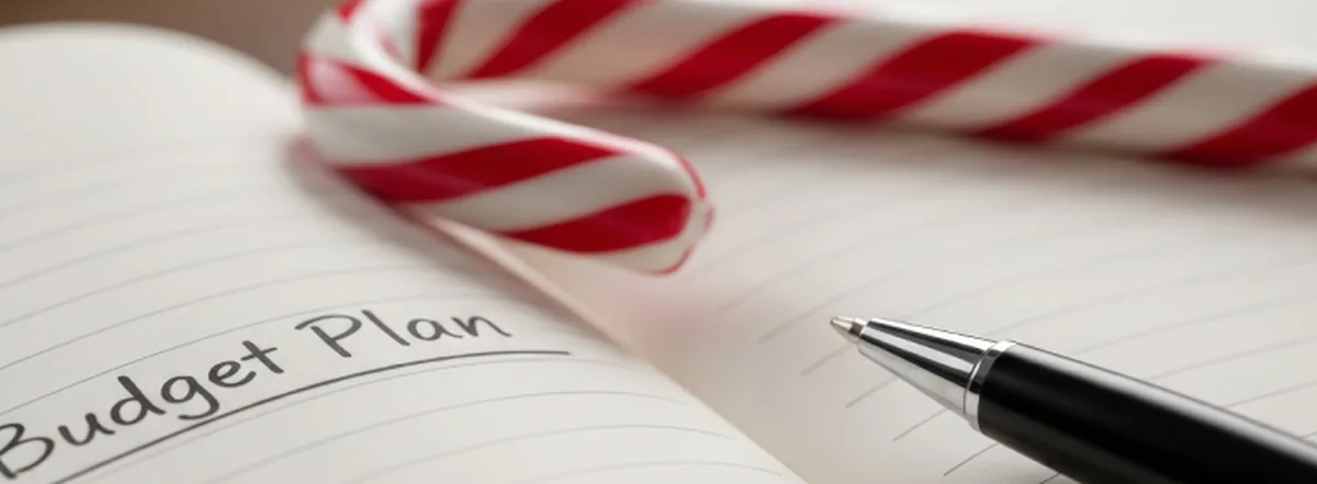 Pen, notebook and red-striped candy cane