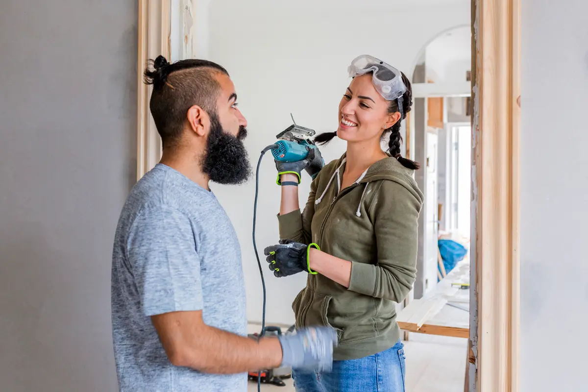 Couple talking during renovation.