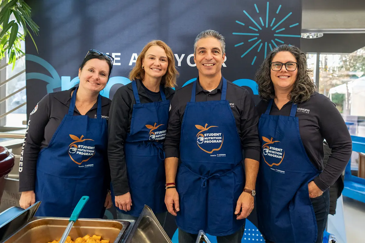 FirstOntario employees volunteering at a student nutrition program.