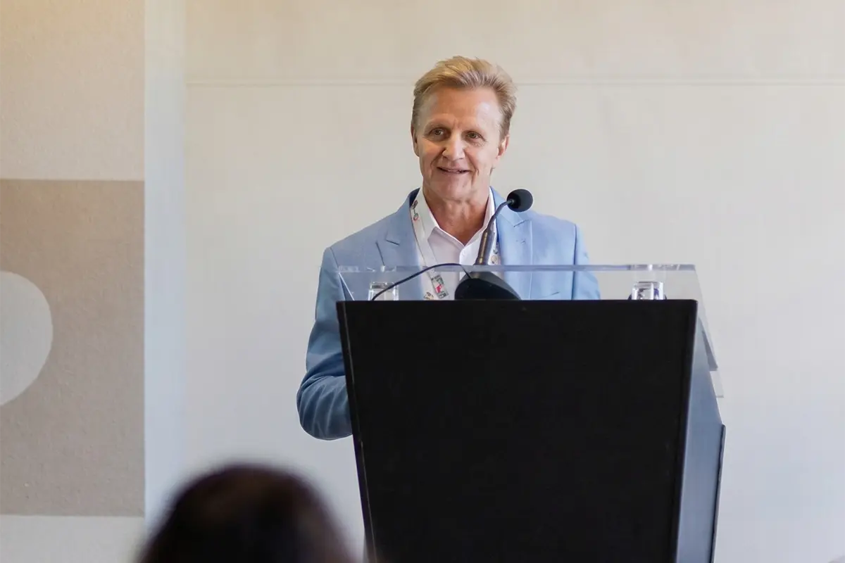 FirstOntario executive speaking at a podium during a formal event.