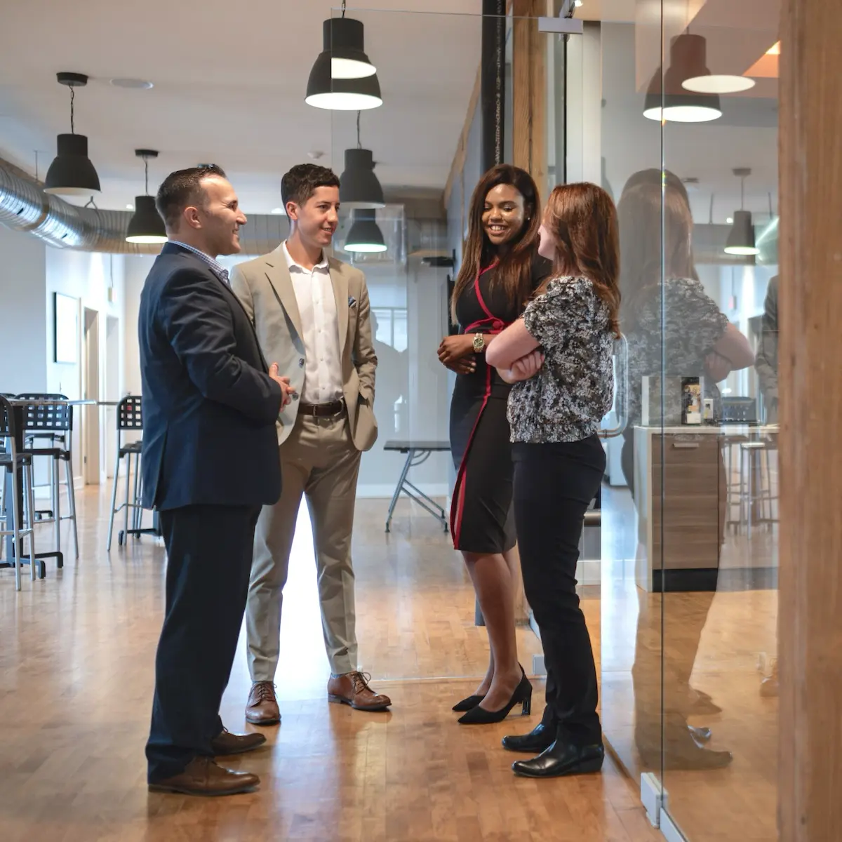 FirstOntario team members connecting and collaborating in a modern office space.