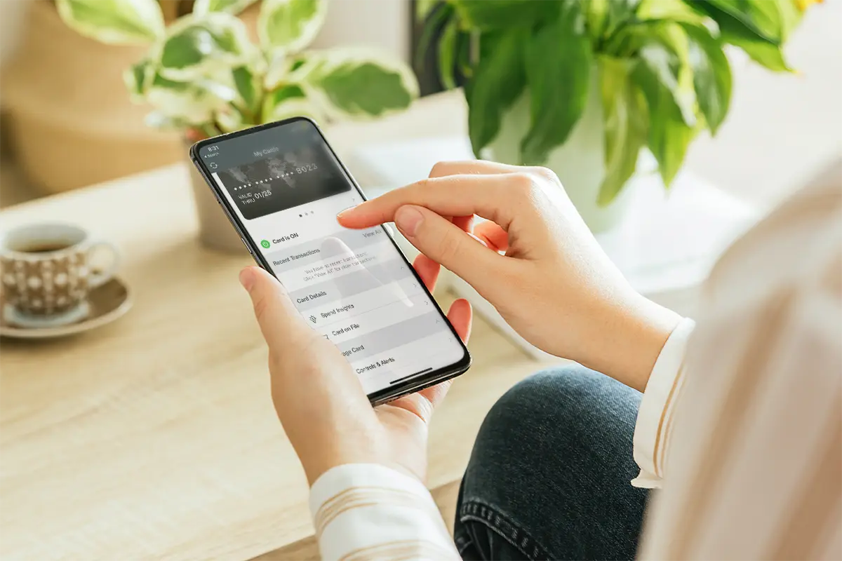 A person using a mobile banking app on a smartphone.