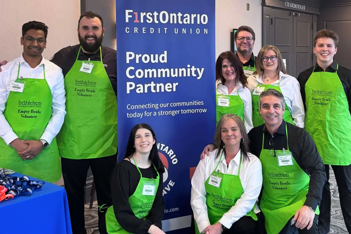 FirstOntario Blue Wave employee volunteers are participating in a community event.